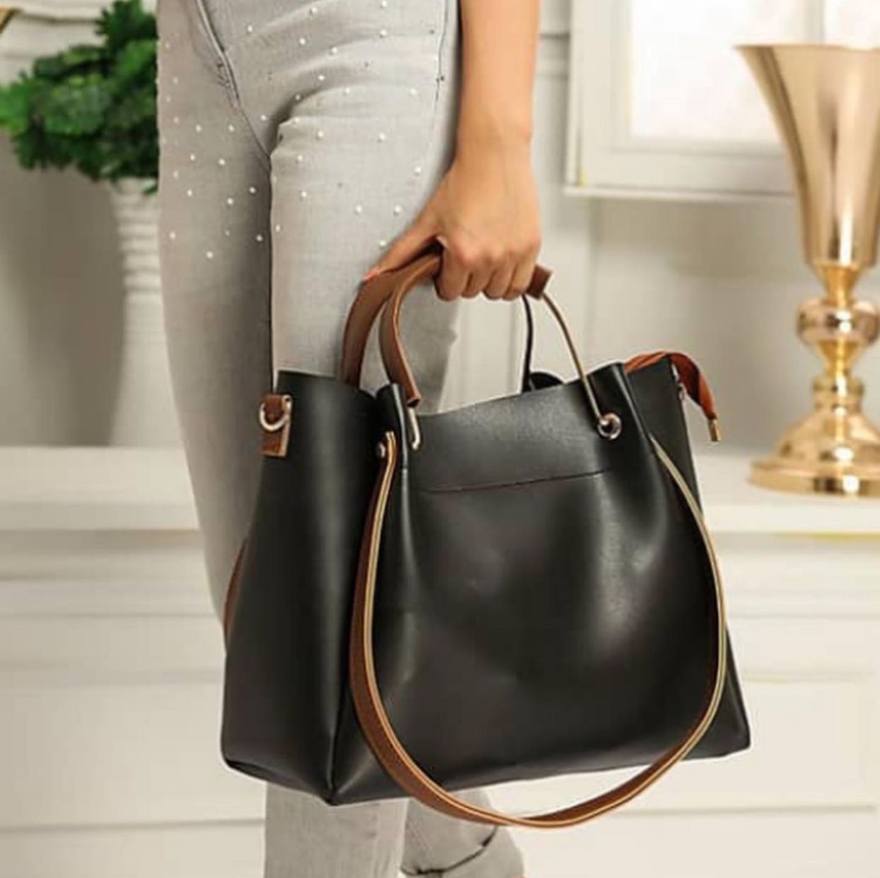 Beautiful black and brown shoulder bag with small pouch inside